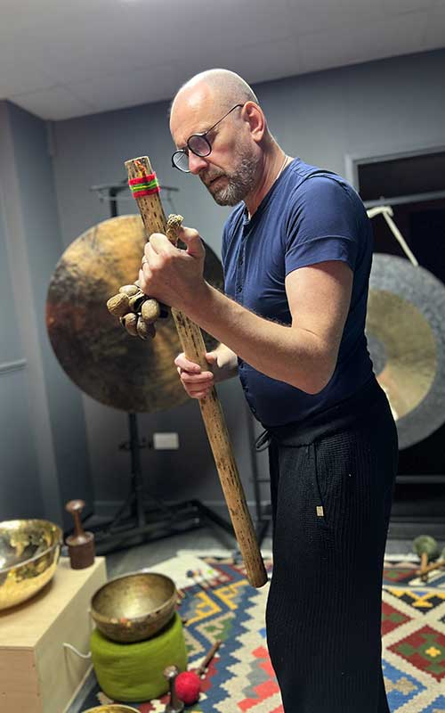 David using a rain stick