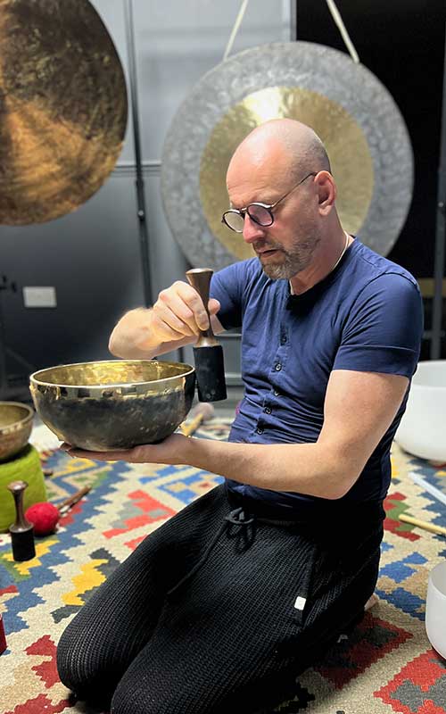 David playing a singing bowl